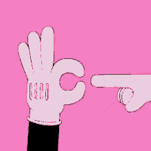 a person wearing a mickey mouse glove is pointing at another person 's hand with a pink heart in the background