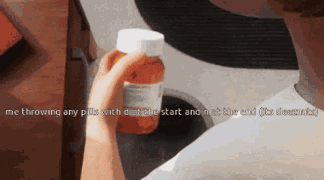a person holding a bottle of pills with the words me throwing any pills with disability the start and not the end