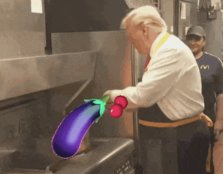 a man in a mcdonald 's uniform is cooking a purple eggplant