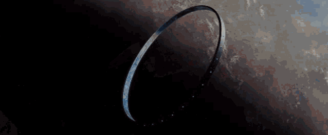 a ring is floating in space above a planet