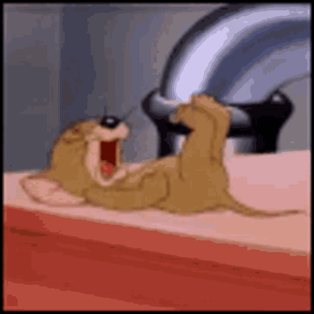 a cartoon mouse is laying on its back on a counter next to a pipe .
