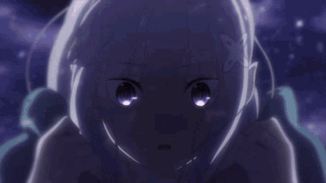a close up of a person 's eye with a purple reflection