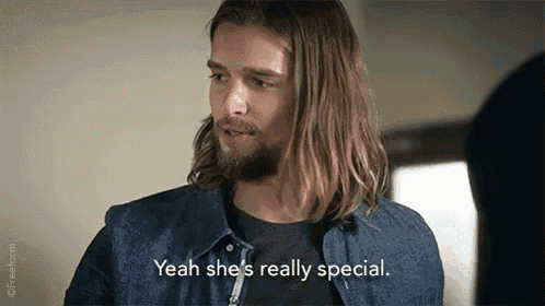 a man with long hair and a beard is talking to another man and says `` yeah she 's really special . ''