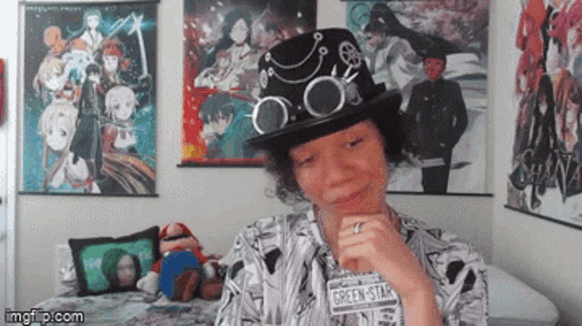 a woman wearing a top hat and a green star shirt