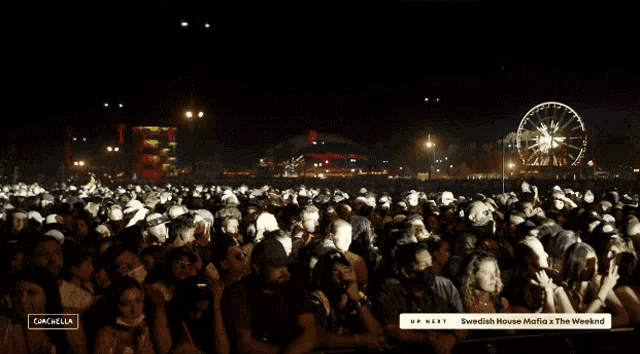a crowd of people watching a concert with the words swedish house mafia x the weeknd on the bottom
