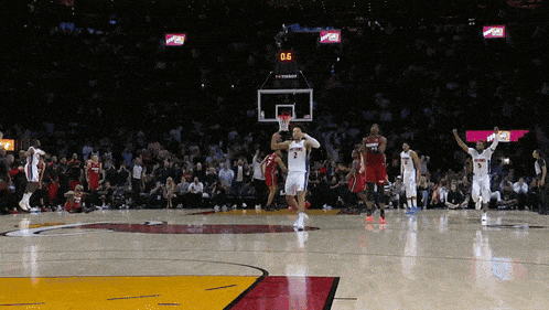 a basketball game is underway and the scoreboard displays a score of 0 to 6
