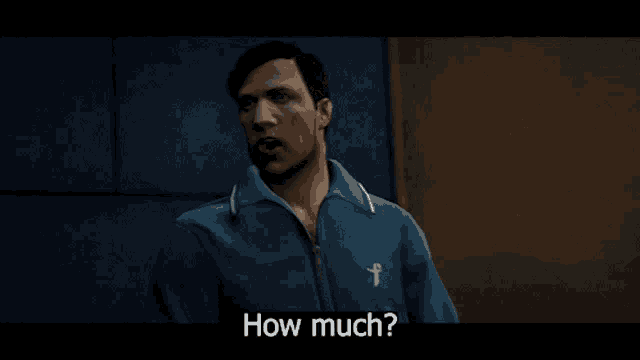 a man in a blue jacket with a white cross on his chest says how much