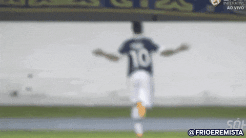 a blurred image of a soccer player with the number 10 on his jersey