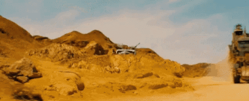 a truck is driving through a desert landscape