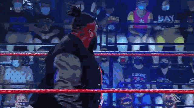 a man in a wrestling ring with the words out of my way behind him