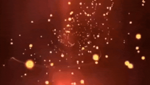 a blurry picture of a red background with a lot of lights coming out of it .