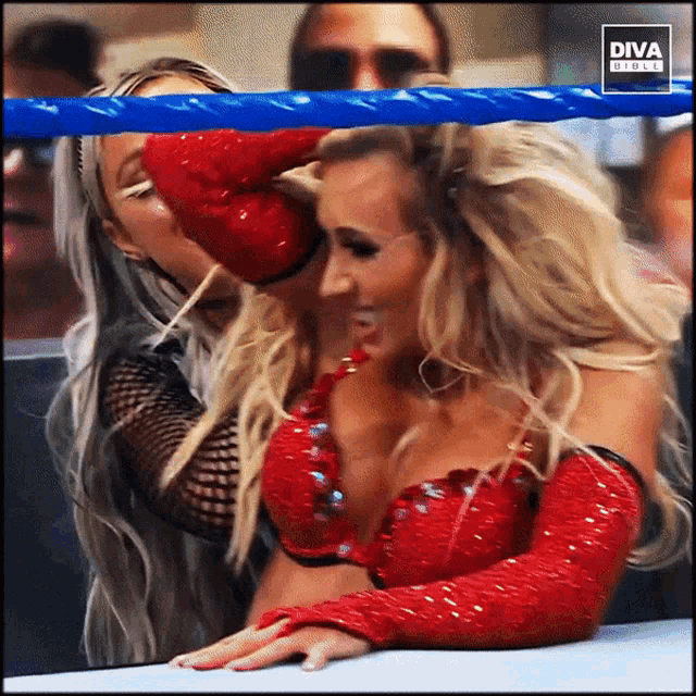 two women are in a boxing ring with diva girls on the bottom