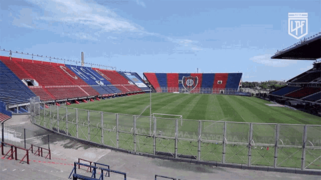 an empty soccer stadium with a ltf logo on the top left