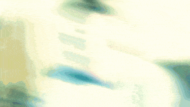 a blurred image of a person 's face with a green and pink background