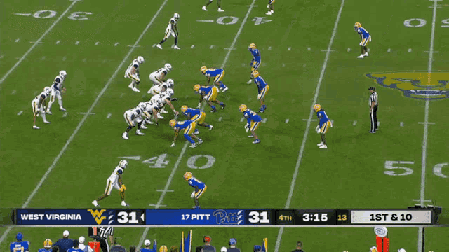 a football game between west virginia and pittsburgh is underway