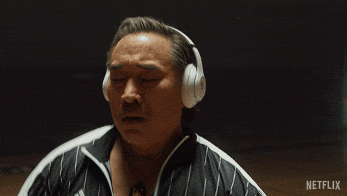 a man wearing headphones with the word netflix in the corner
