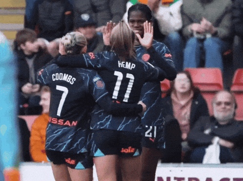 a group of female soccer players including coombes and hemp