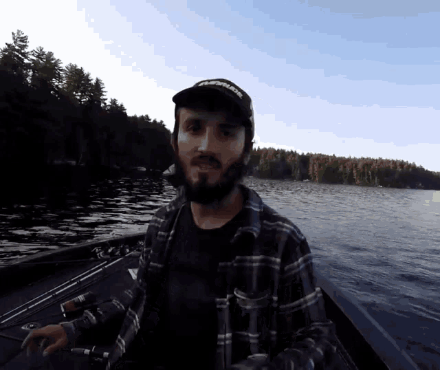 a man with a beard wearing a hat that says heavyweight
