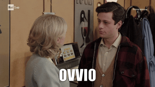 a man and a woman are looking at each other with ovvio written on the bottom