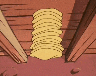 a stack of pancakes is hanging from the ceiling of a room .