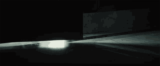 a person 's feet are visible in the dark