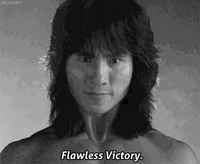 a black and white photo of a shirtless man with long hair saying flawless victory