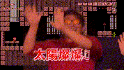 a man wearing sunglasses is standing in front of a video game screen with chinese characters on it