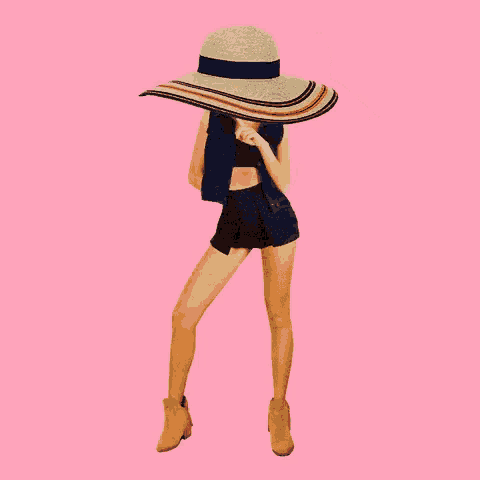 a woman wearing a denim vest and shorts holds a large straw hat over her head