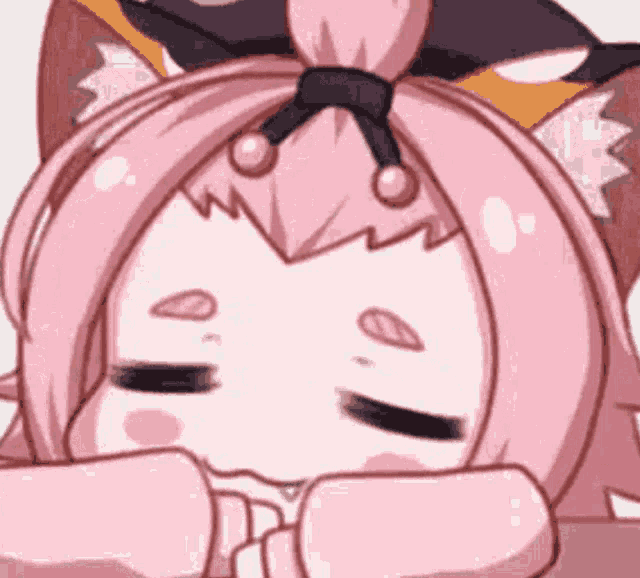 a close up of a cartoon girl with pink hair and cat ears sleeping .