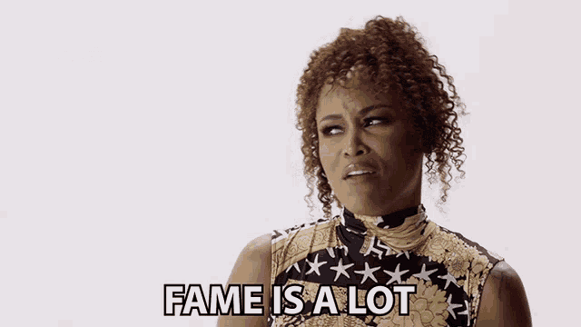 a woman says fame is a lot while wearing a black and gold dress