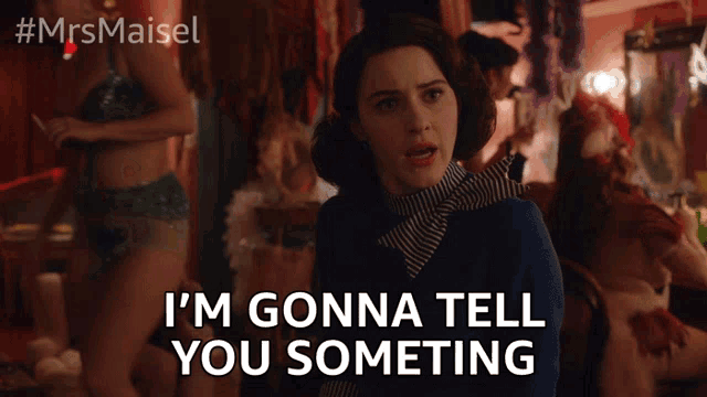 a woman says i 'm gonna tell you something in front of a group of dancers