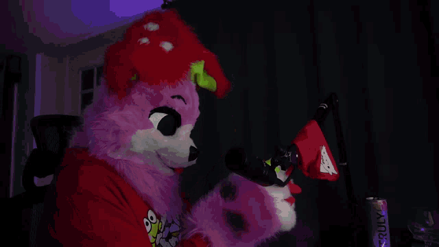a furry mascot is standing in front of a truly energy drink