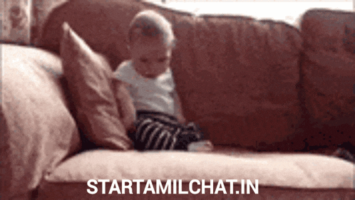 a baby is sitting on a couch with the website starttamilchat.in written on the bottom