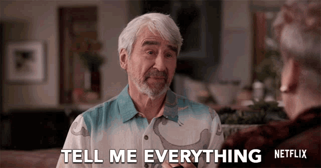 a man with gray hair and a beard is talking to another man and says " tell me everything "