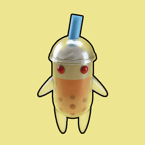 a bubble tea cup with a blue straw on top of it