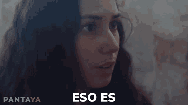 a close up of a woman 's face with the word impossible in the corner