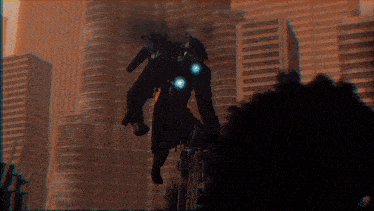 a robot is flying through the air in front of a city skyline