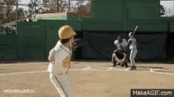 a baseball player in a yellow hat is throwing a ball on a field