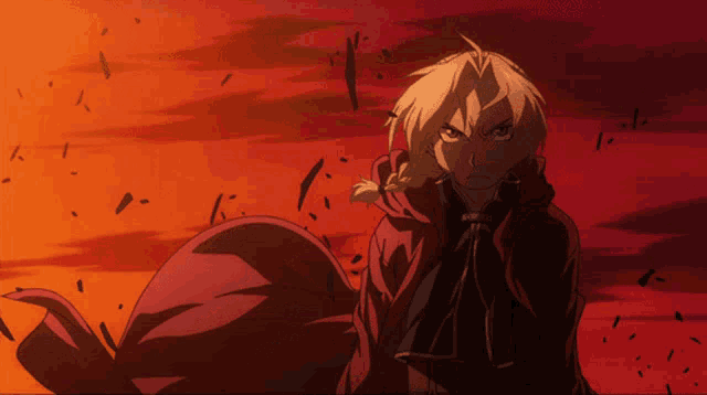 a man in a red cape stands in front of an orange sky