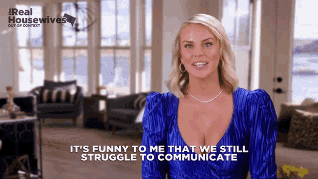 a woman in a blue dress is talking about real housewives