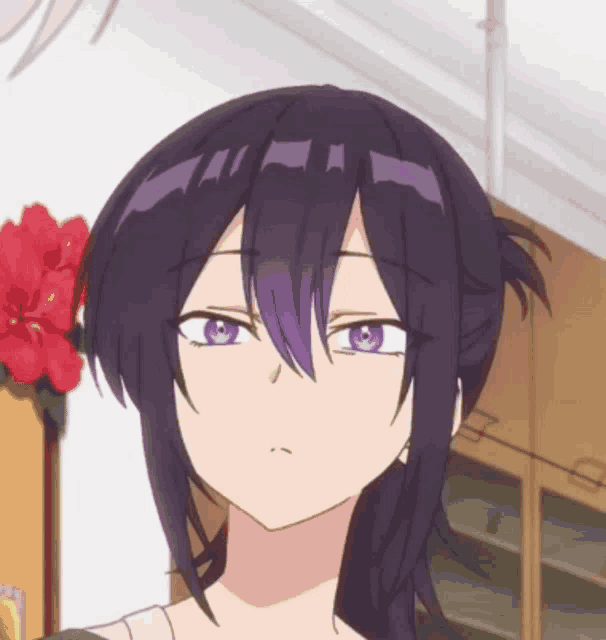 a girl with purple hair and purple eyes looks at the camera