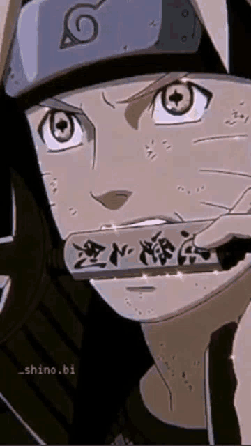 a close up of a person holding a sign in their mouth .