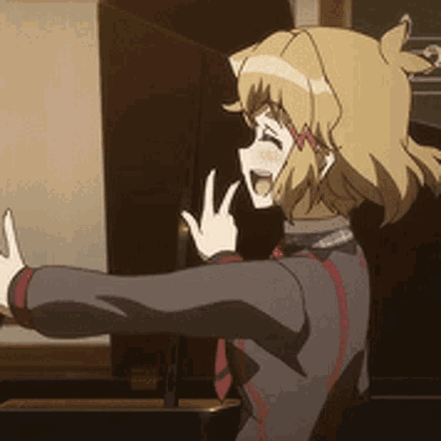 a cartoon girl is standing in front of a blackboard and giving a peace sign .