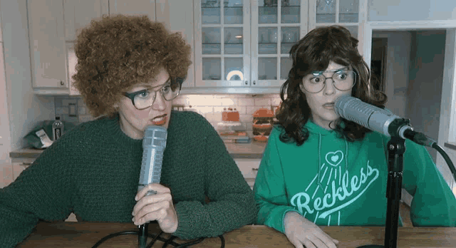a woman wearing a green sweatshirt that says reckless