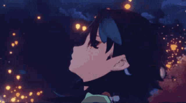 a close up of a person 's head with lanterns in the background