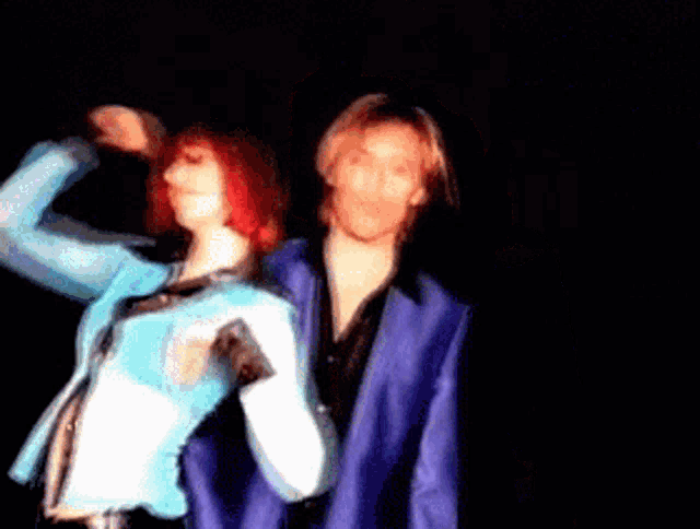 a blurry photo of a man and woman dancing