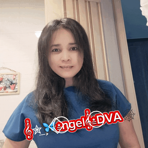 a woman in a blue shirt with angel dva written on it