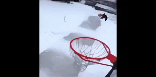 a basketball is going through a basketball hoop