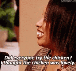 a woman is smiling and talking about chicken .