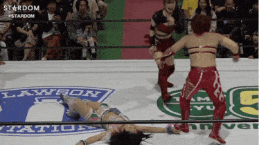 a woman in a wrestling ring with the word lawson on the floor